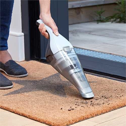 BLACK+DECKER Handstaubsauger Akku 7,2V Dustbuster (Handsauger beutellos + kabellos, breite Saugöffnung, spülmaschinenfester Staubfangbehälter inkl. Fugendüse & Ladestation mit Wandhalterung) NVC215W - Image 7