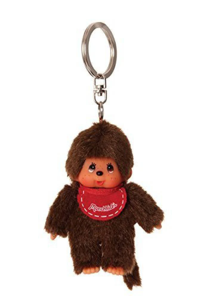 Sekiguchi 2534 - Original Monchhichi Mädchen oder Junge als Schlüsselanhänger, Plüschfigur mit Lätzchen, ca. 10 cm großer Anhänger aus braunem Plüsch für Rucksäcke, Taschen und Federmappen